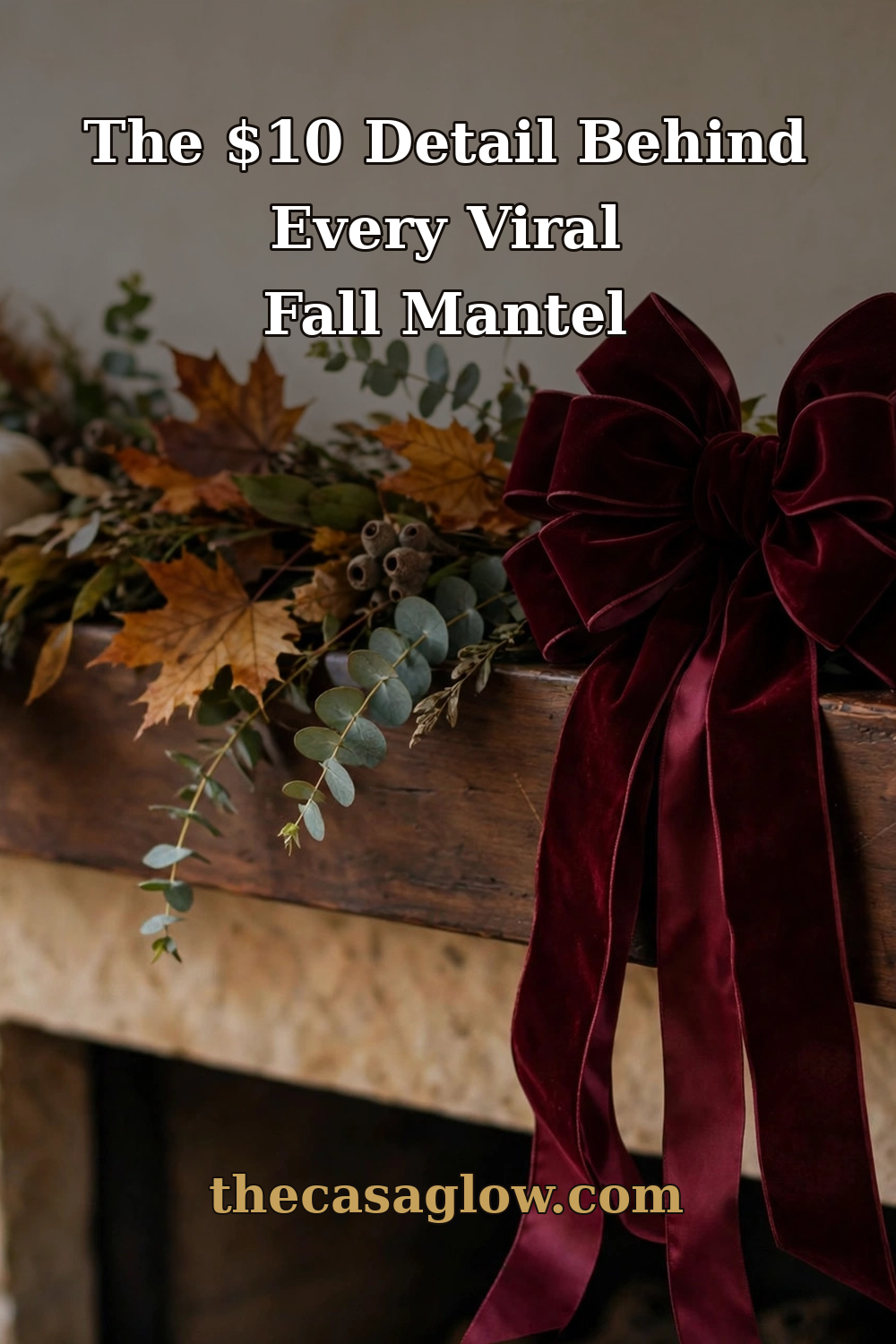 Fall mantel styled with burgundy velvet bows, garland, and pumpkins