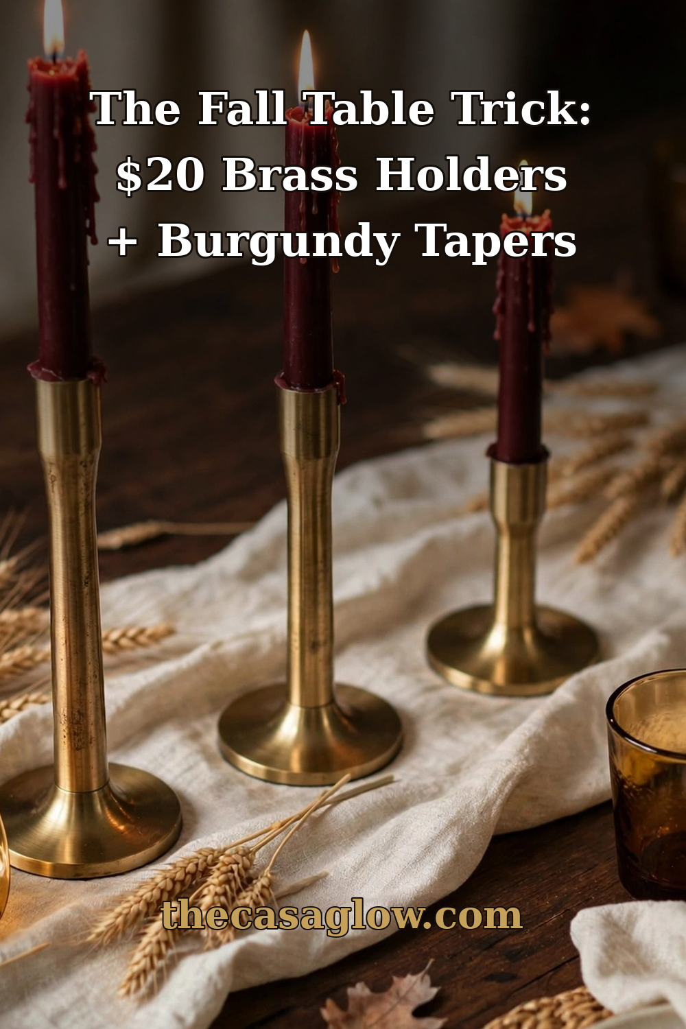 Fall table decor trick: three brass candlesticks with burgundy taper candles