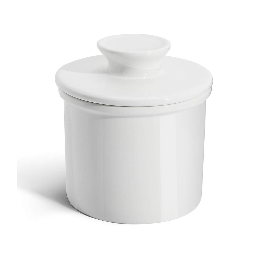 Sweese white porcelain French butter crock with knob lid on a wooden table