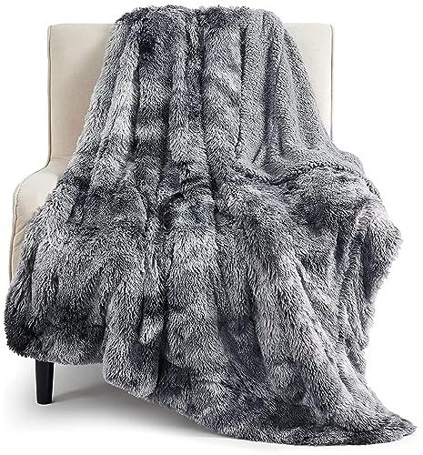 Bedsure GentleSoft fluffy fuzzy faux fur throw blanket in grey 50x60 draped on a couch